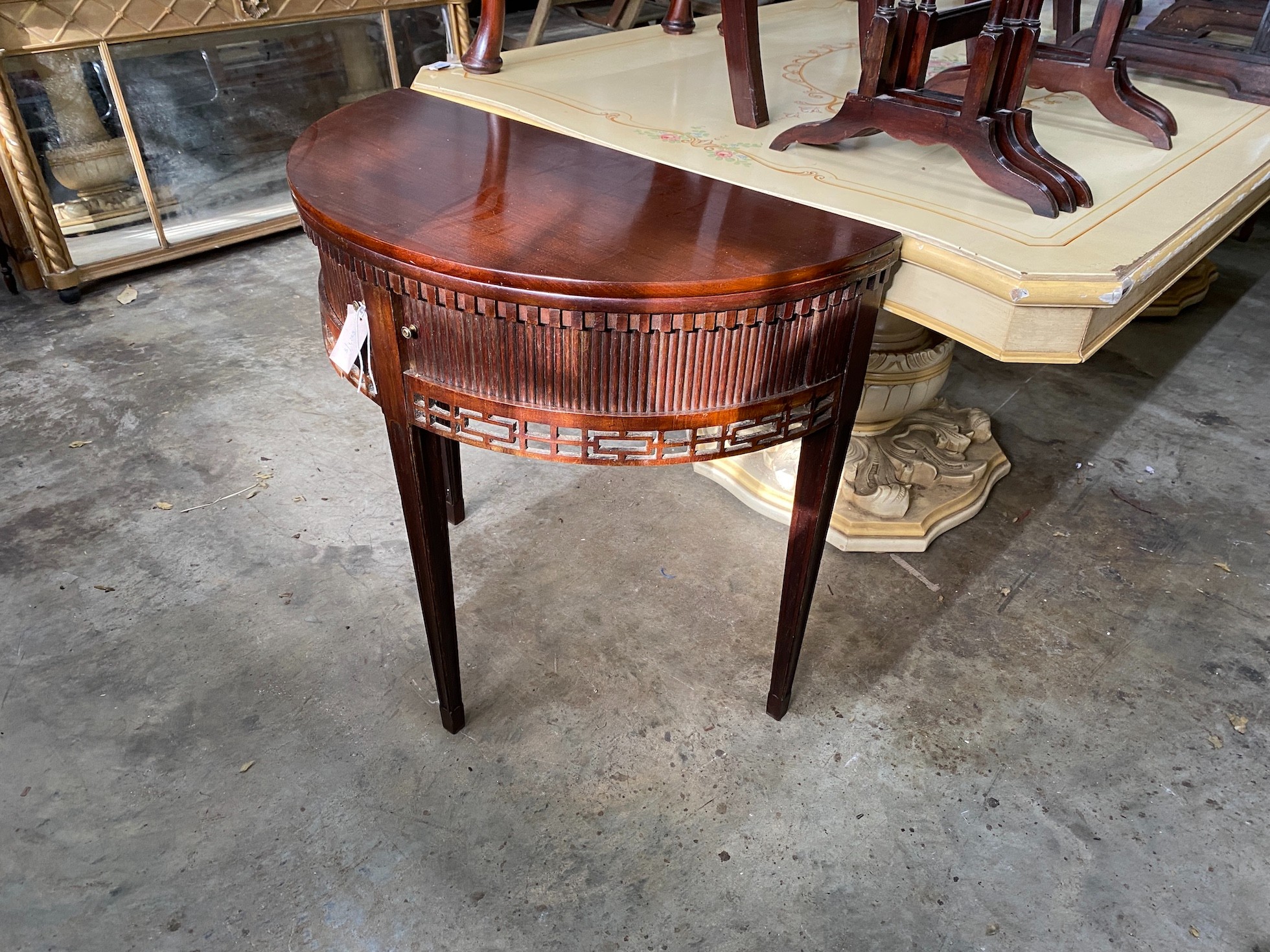 A reproduction George III style mahogany demi lune folding tea table, width 77cm, depth 38cm, height 75cm